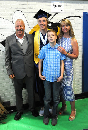 Hunter DeVon with his parents Rocky DeVon and Cindy Dietrich and his brother Cash.