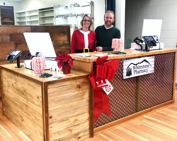 Laura Knowlton/staff photo Mike and Stephanie Steinman greet the community during their open house for Whitestone Pharmacy this past weekend during Winterfest.