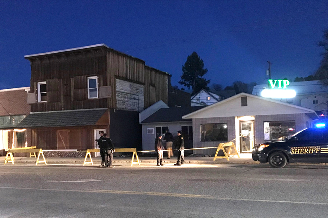 Laura Knowlton/Staff photo Deputies from the Okanogan County Sheriff’s office cordon off the former Roundup Cafe’ in Tonasket after a dead body was found in one of the rooms upstairs. A suspect was later arrested in Loomis and the sherrif’s office is looking for anyone who might have information on the incident that took place last Saturday.