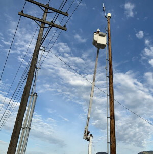 Up high: Talk about social distancing. Crews installed the hotspots at access points throughout the county.