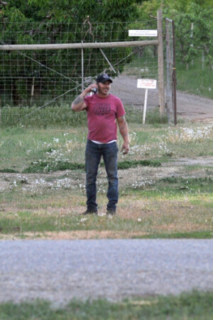 Suspect Jon DeVon doesn’t look to concerned after backing out of a shop building that he had barricaded himself in on Sawtells Road. He was told to lay face down and taken into custody.