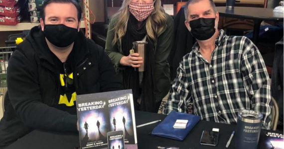 <em>On Feb. 12 local author Brent Baker (right) hosted a book signing party for his debut novel, “Breaking Yesterday,” at Beyer’s Market, along two other artists, Nicole Unser and Caleb Knowlton, who have worked with Baker on projects. </em>
Laura Knowlton/staff photo