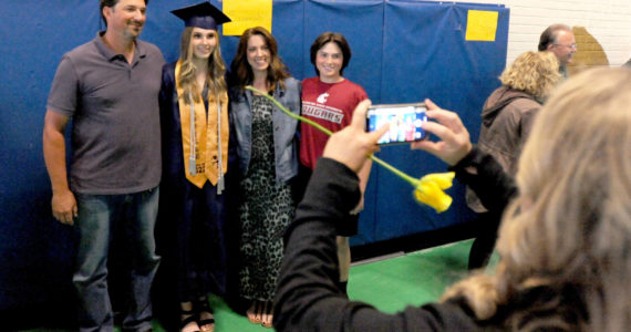 Savannah Berg and family pose for post-grad photos.