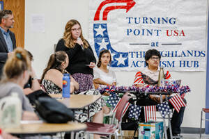 Members of Turning Point USA ask questions of the candidates for sheriff.