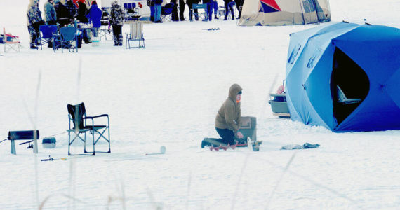 A scene from the 2021 NW Ice Fishing Festival at Sidley Lake in Molson. Whether you have an ice hut to sit in, a camp chair or a five-gallon bucket to sit on, the popular annual event sponsored by the Oroville Chamber of Commerce attracts anglers from all over the state to try and land a prize winning fish. Many use the festival to reconnect with relatives who remain in the Highlands or nearby Oroville.
<em>Gary DeVon/GT file photo </em>