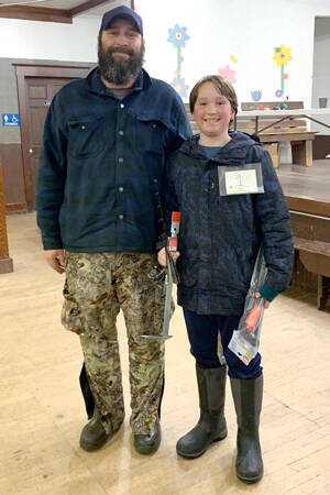Douglas Vanslyle, the youngest angler in the contest won first prize in the Youth Division of the NW Ice Fishing Festival. He and his dad went up to pick up the prize, a new ice fishing pole and an auto ice ladel.
<ins>Peggy Shaw/submitted photo </ins>