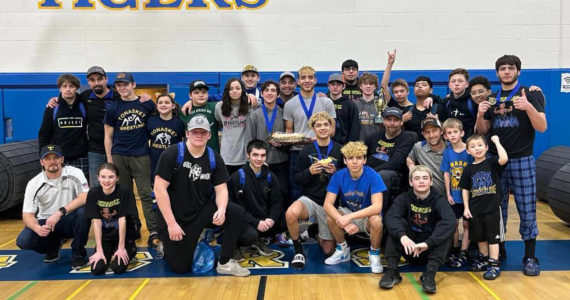 Members of the Tonasket Tigers Wrestling get ready to celebrate their team win following their annual Apple Pie Tournament. Submitted photo