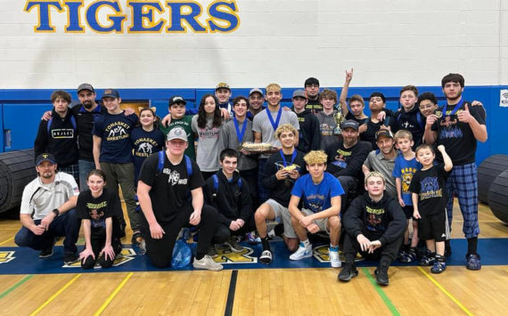 Members of the Tonasket Tigers Wrestling get ready to celebrate their team win following their annual Apple Pie Tournament. Submitted photo