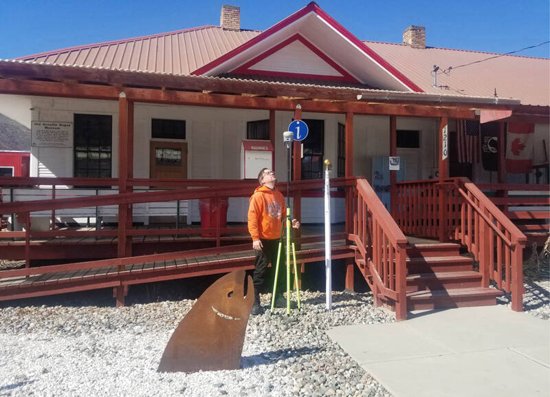 Angela Larson/staff photos
Patrick Miller with the U.S. Geological Survey next to the flagpole at the Oroville Depot Museum. Miller said the flood of 1894 reached a level of 927 feet of elevation, or 18 feet above the regular water level of 909 feet today.