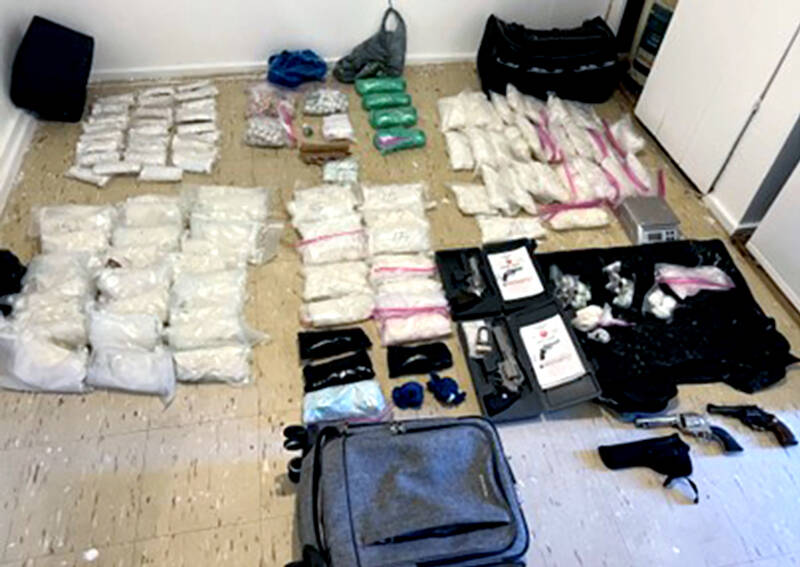 DEA photos Some of the more than 100 pounds of illegal drugs and weapons seized by federal, state, local and tribal law enforcement last Monday near Oroville, Washington.