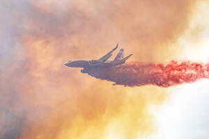 Plane drops retardant during June of the 2021 wildfire season. Laura Knowlton/GT File Photo