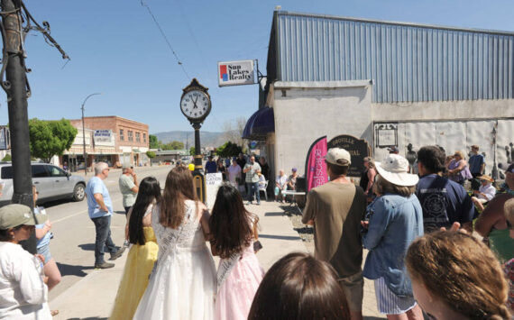 The crowd, including the May Festivel Royalty, listens as Oroville Mayor Ed Naillon talks about what the community clock represents to the city. Gary DeVon/staff photos