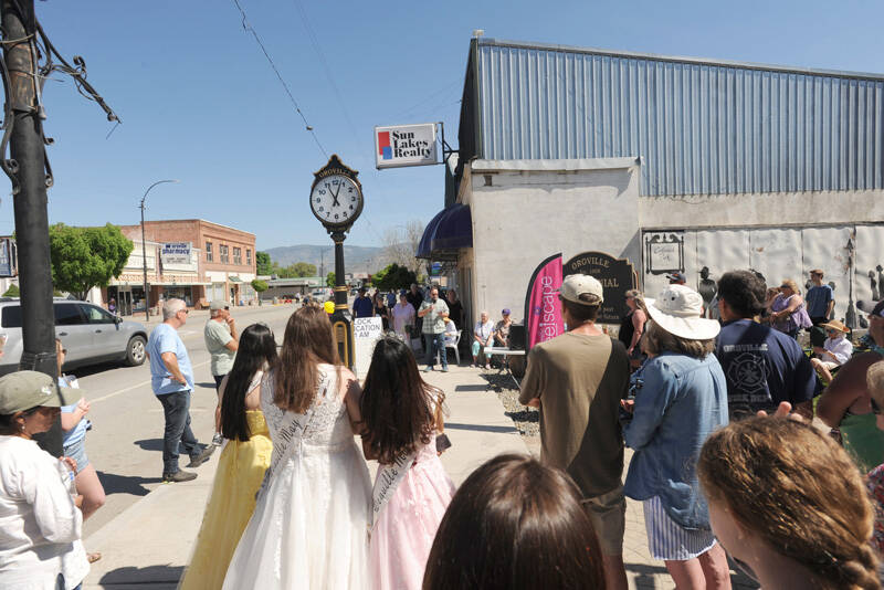 The crowd, including the May Festivel Royalty, listens as Oroville Mayor Ed Naillon talks about what the community clock represents to the city. Gary DeVon/staff photos