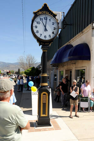 Lynn Chapman, former head of Oroville Streetscape, talks about how that organization was responsible for obtaining the Oroville Community Clock at a dedication ceremony held at Centennial Park on May 13.