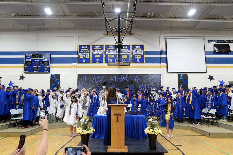 Tonasket Graduates prepare to move their tassels to the other side of their morterboards at their commencement ceremony held at the Tonasket High School gym on Saturday, June 3. Kelly Denison/submitted photoa