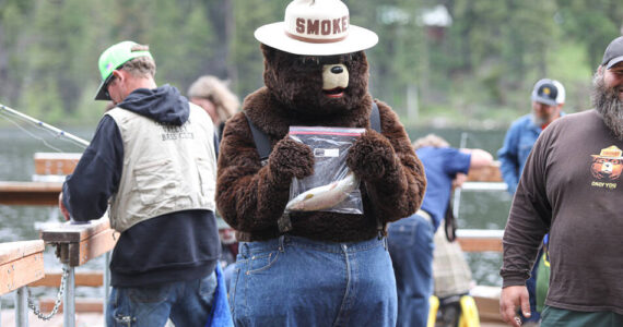 Smokey Bear catches a fish during the 2023 Bonaparte Lake Resort free fishing day festivities on Saturday, June 10. <em>Laura Knowlton/staff photos</em>