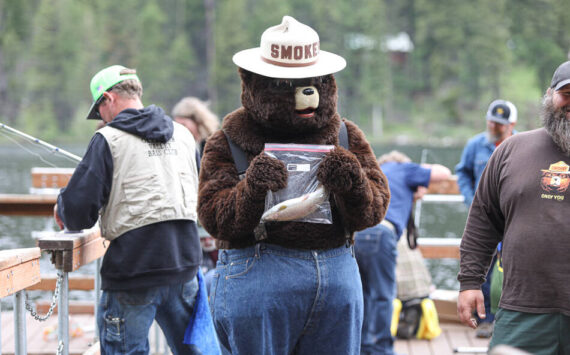 Smokey Bear catches a fish during the 2023 Bonaparte Lake Resort free fishing day festivities on Saturday, June 10. <em>Laura Knowlton/staff photos</em>