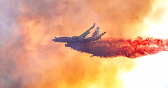 A plane drops fire retardant on the Pine Creek Fire in June of 2021. The fire was quickly brought under control by local, state and federal firefighters. The blaze was controlled before any evacuation notices were needed. The Tonasket Fire Department said it was an excellent save on the Pine Creek Fire and Fire Chief Gasho credited the good work of his department and state and federal partners. Laura Knowlton/GT file photo