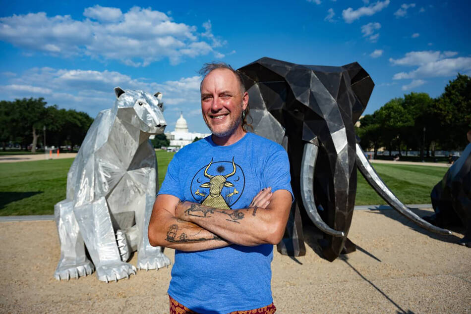 Artist Quill Hyde poses with their exhibit for PETA on the National Mall in Washington, DC. Submitted photos/PETA
