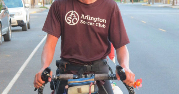 Submitted photo Brooks Enzensperger, 16, arrives in Oroville after cycling 3500 miles from Vermont to his grandfather’s in Oroville as a challenge to himself. He was greeted by well wishers including his grandfather Joseph Enzenspeger and his great aunt.