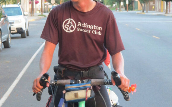 Submitted photo Brooks Enzensperger, 16, arrives in Oroville after cycling 3500 miles from Vermont to his grandfather’s in Oroville as a challenge to himself. He was greeted by well wishers including his grandfather Joseph Enzenspeger and his great aunt.