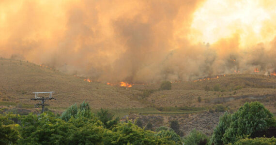 Fire burns along the ridge of a hillside west of Oroville, after traveling three miles from Blue Lake Road last month. The fire eventually burned across the border into Canada.. The state Deptartment of Natural Resources has begun using remotely operated cameras around the state to scan for signs of wildfire and dispatch fire and quickly alert authorities to respond. Gary DeVon/GT File Photo