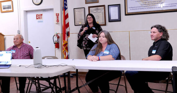 Candidates for Oroville City Council Walt Hart, Tasha Shaw and Robert Fuchs at the Candidates Forum sponsored by the Oroville Chamber of Commerce and the Okanogan Valley Gazette-Tribune. Hart, the incumbent is being challenged by Fuchs, a former councilman, for Position 4 on the council. Shaw, is being challenged by Paul Bouchard, who wasn’t in attendance, for Position 1. Tonasket Councilwoman Teagan Levine, standing, served as moderator. <em>Gary De Von/staff photo</em>