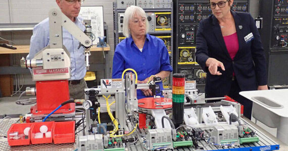 U.S. Sen. Patty Murray (center) and Rick Luebbe (left), CEO of Group14 Technologies, hear from Big Bend Community College president Dr. Sara Thompson Tweedy about vocational and technology training during an Aug. 2 visit to the school’s Workforce Education Services department. Randy Bracht | The Center Square