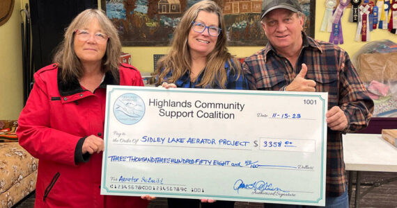 The Highlands Community Support Council (HCSC) donated enough money to rebuild an aerator to replace the one at Sidley Lake. Laura Robinson, HCSC Treasurer, Anne Alden, HCSC Secretary and Kevin Myrick, HCSC board member and volunteer with a check representing the donation. HCSC/submitted photo