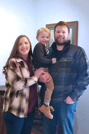 Brandon Heilman and family at the Oroville office of Farmer’s Insurance. The familiar local agent has taken over ownership of the business. Angela Larson/staff photo