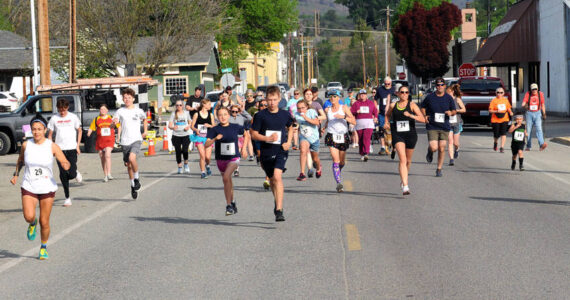 Gary DeVon/staff photos
Runners in the 42nd Annual May Festival Fun Run blast down Appleway for the start of the race. Runners, and walkers, participated in either a 5K or two-mile race.