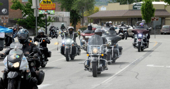 There back! After a four-year absence, the Run for the Border Charity Motorcycle ride returned to Oroville for Armed Services Day on Saturday, May 18. The 150-mile ride from Wenatchee and back is sponsored by the Columbia River Harley Owners Group (HOG). This year 90 machines left Wenatchee for the journey north and arrived in Oroville around noon. <em>Gary DeVon/staff photo </em>