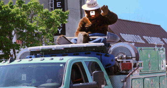 Smokey Bear rides on top of a U.S. Forest Service (USFS) truck in the May Festival Parade. Smokey is a familiar sight at May Fest as well as events around the country and his “Only You Can Prevent Forest Fires” is familiar to nearly every school-age child in the nation. The Department of Natural Resources (DNR) has teamed up with none other than the iconic Smokey Bear. The DNR has received funding from the USFS to wrap 10 trailers with Smokey’s image, as well as fire prevention information and resources. Gary DeVon/GT file photo