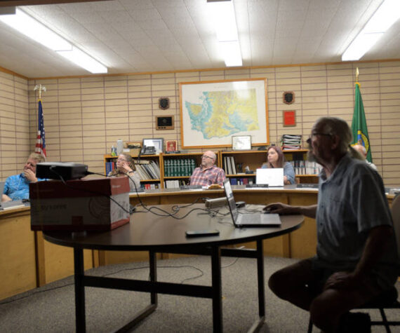 Oroville City Planner Kurt Danison projects the new Comprehensive Parks Plan on the wall and walks the city council through the plan last August. He will be at the next council meeting, March 18, for a public hearing on the new zoning codes and zoning map. Gary De Von/GT file photo