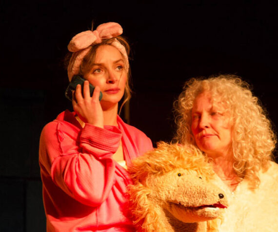 Danika Smith in the lead role as Diedra in “The Pack,” a new theater production showing at the Tonasket Community Cultural Center. She is seen here with Julie Alley, who plays the new poodle puppy Maxi. Rob Thompson/submitted photos