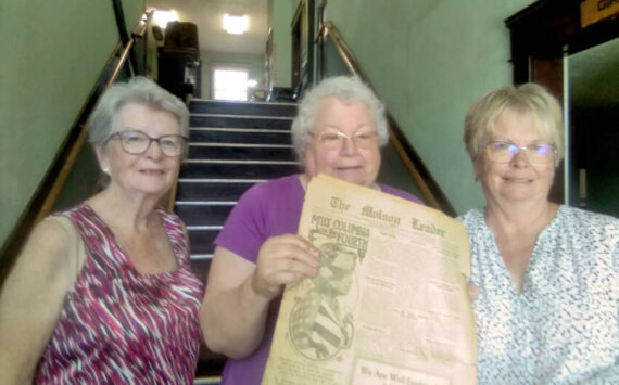 Donna St. John, who helped deliver the old <em>Molson Leader</em> and <em>Oroville Gazette</em> issues to the Molson Schoolhouse Museum with museum volunteer Joanie Emry Raymond and Janet Barstow, manager of the Roy M. Chatters Newspaper and Printing Museum. Salley Bull/submitted photos