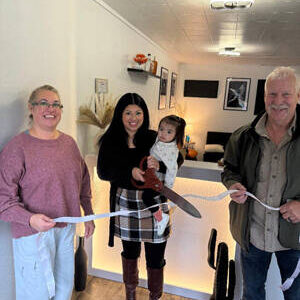 Oroville WA Chamber of Commerce President Rocky DeVon cuts the ribbon welcoming Shelly Valverde and her business, Monarch Salon. Valverde is seen here with her daughter, Milan Mathews. Also pictured holding the ribbon is Shelly Roberts, Oroville Chamber secretary. OWCoC/Submitted photo