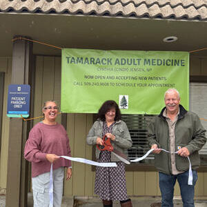 Cindy Jensen cuts the ribbon, opening her new business, Tamarack Adult Medicine. Oroville WA Chamber of Commerce President Rocky DeVon and Oroville Chamber Secretary Shelly Roberts participated in the ribbon-cutting ceremony. OWCoC/Submitted photo