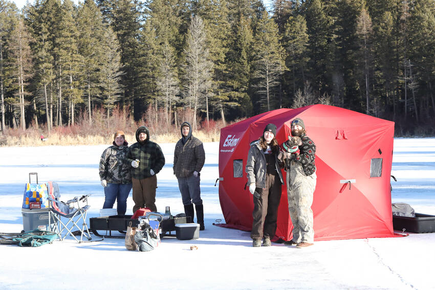 Anglers line the ice at Bonaparte Lake during the 4th Annual Ice Fishing Derby held last Saturday, drawing famillies and competitors out for a day of winter fun. Laura Knowlton/staff photo
