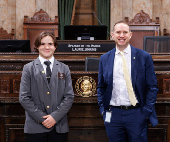 Page Teak Plank with Rep. Hunter Abell at the Speakers Rostrum on the House floor, Jan. 29. Washington State House of Representatives photo