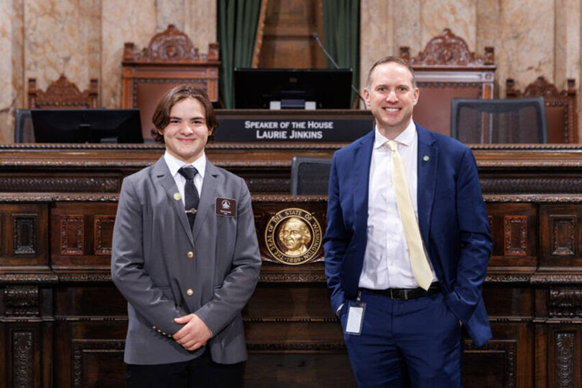 Page Teak Plank with Rep. Hunter Abell at the Speakers Rostrum on the House floor, Jan. 29. Washington State House of Representatives photo