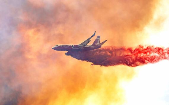 A plane drops fire retardant on the Pine Creek Fire in June of 2021. GT file photo
