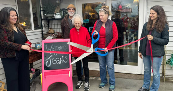 Jean Cooksey, 91, owner, along with her daughter Susan Cooksey, and Dave Martin were joined by Tonasket Mayor Alisa Weddle, Aisha Rodriguez and members of the Tonasket Chamber of Commerce, on Saturday morning to celebrate the reopening of Jeans on 3rd. Laura Knowlton/staff photo