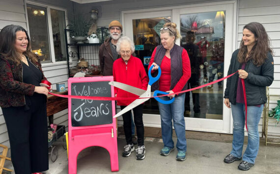 Jean Cooksey, 91, owner, along with her daughter Susan Cooksey, and Dave Martin were joined by Tonasket Mayor Alisa Weddle, Aisha Rodriguez and members of the Tonasket Chamber of Commerce, on Saturday morning to celebrate the reopening of Jeans on 3rd. Laura Knowlton/staff photo