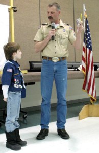 Bear Cub Josh Crazy receives badges from Kelvin Davis during the awards ceremony Jan. 6.