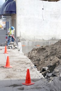 Photo by Gary DeVon Brad Calico, with Oroville Public Works, takes a pneumatic jackhammer to the remains of the low cement wall that was removed from the front of what will soon be Oroville’s Centennial Par
