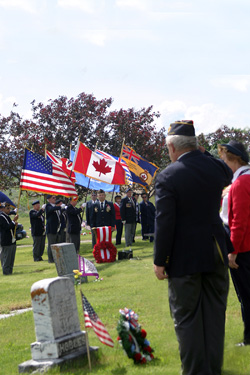 Photo by Gary DeVon            Ardie Halvorsen and Dee Patterson laid a wreath at the headstone of Major Hodges. The Oroville American Legion Post is named in honor of Hodges who died in World War I. Aft