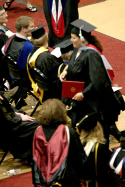 Photo by Gary DeVonNichole DeVon (standing, with diploma) after receiving her double Master’s Degree from EWU, Saturday, June 14.