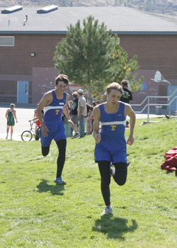 Photo by Terry Mills Two Tonasket cross country runners get close to the finish line at Saturday’s meet. The Tonasket boys’ team came in third overall. Photo of Spencer Podkranic, and Tyler Monroe for Tonasket.