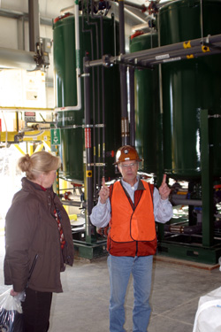 Photo by Gary DeVon            RichardSolopek, an environmental engineer with Kinross’ Kettle River Operations,describes the water treatment system at the m